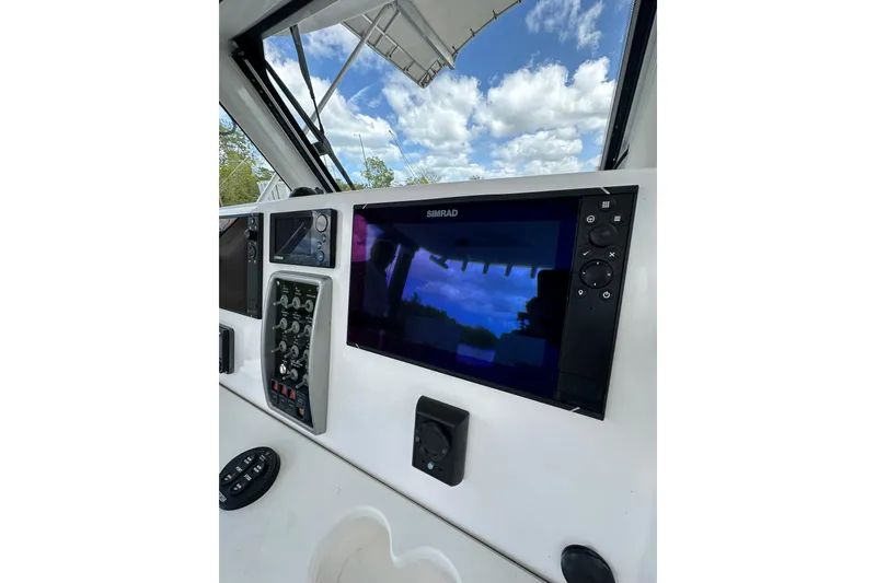 Slide: The Image of Control panel of 2015 Everglades 295 Center Console boat with navigation display. - 22