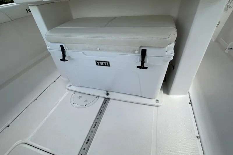 Slide: The Image of YETI cooler with cushioned seat on 2015 Everglades 295 Center Console boat. - 29