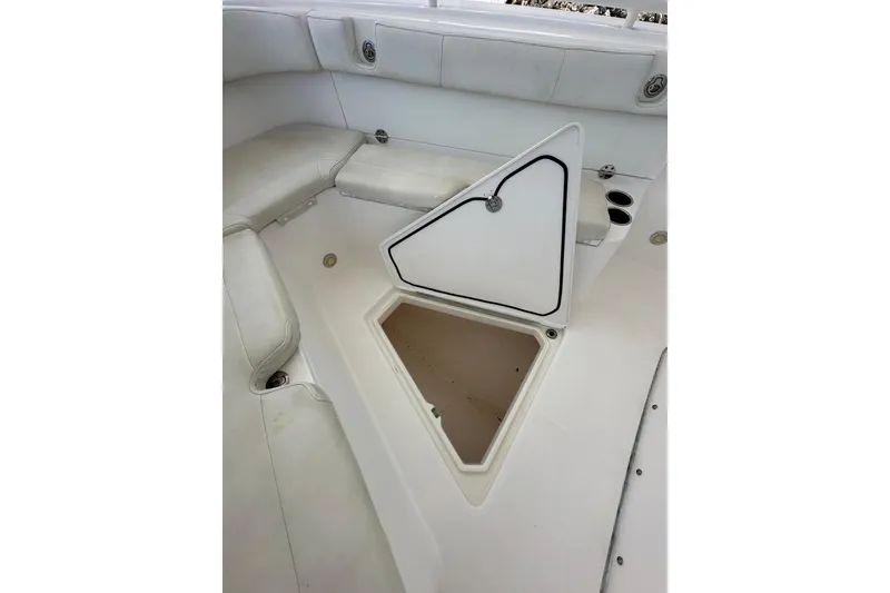 Slide: The Image of 2015 Everglades 295 Center Console boat interior with open storage compartment. - 35