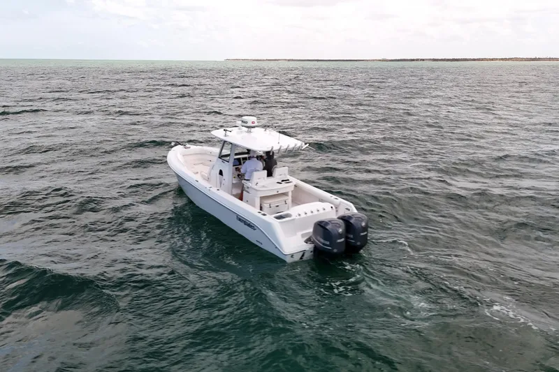 Slide: The Image of 2015 Everglades 295 Center Console boat cruising on open water. - 4