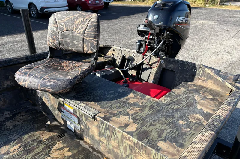 Slide: The Image of 2022 Crestliner 1546 Retriever boat with camo seating and Mercury outboard motor. - 14