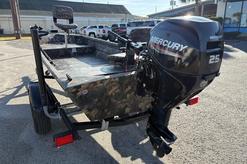 Slide: The Image of 2022 Crestliner 1546 Retriever boat with Mercury 25 outboard motor, parked on a trailer. - 7