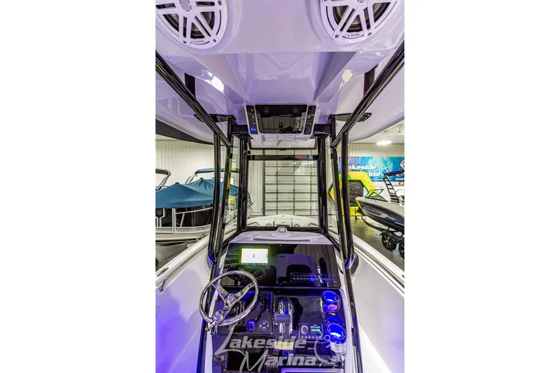 Slide: The Image of Interior view of 2026 Tidewater 210 CC Adventure boat cockpit with modern controls. - 22