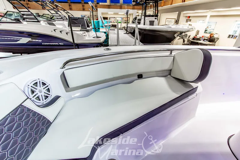 Slide: The Image of 2026 Tidewater 210 CC Adventure boat interior with cushioned seating at Lakeside Marina. - 37