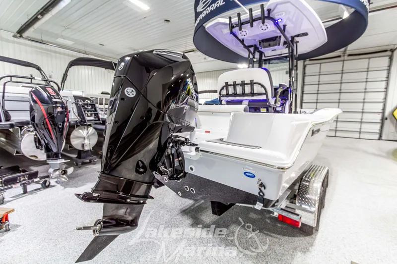 Slide: The Image of 2026 Tidewater 210 CC Adventure boat with powerful outboard motor in showroom. - 4