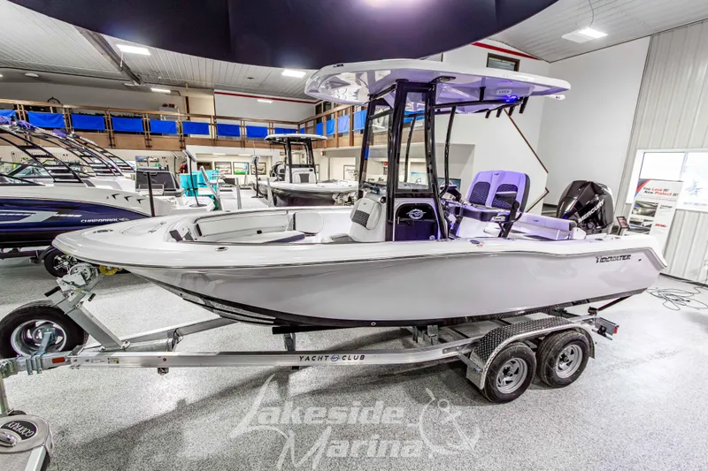 Slide: The Image of 2026 Tidewater 210 CC Adventure boat on trailer in showroom setting. - 9