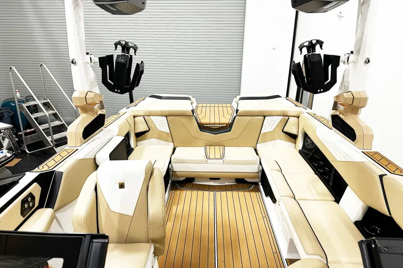 Slide: The Image of 2025 Nautique Super Air Nautique S23 interior with luxurious seating and modern design. - 5
