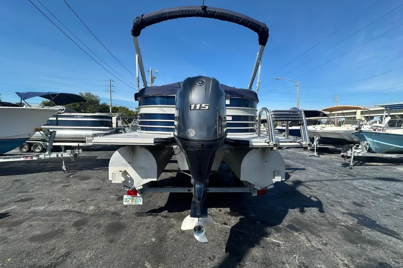 Slide: The Image of 2018 Sylvan Mirage Cruise 8520 pontoon boat with 115 HP engine, parked on a trailer. - 4