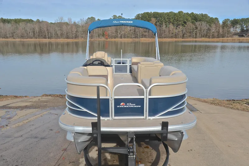 Slide: The Image of 2019 Sun Tracker Party Barge 22 XP3 pontoon boat on a lakefront. - 17