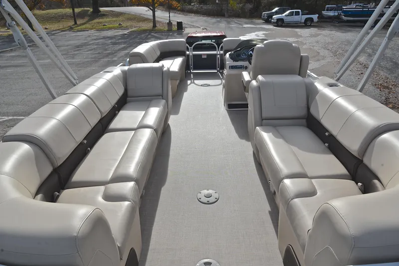 Slide: The Image of 2019 Sun Tracker Party Barge 22 XP3 interior with spacious seating and steering console. - 18