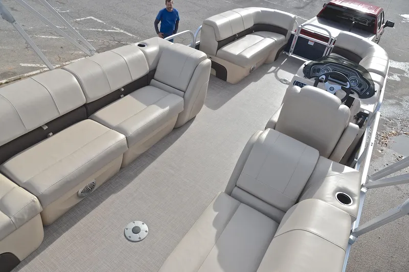 Slide: The Image of 2019 Sun Tracker Party Barge 22 XP3 with spacious seating and modern dashboard. - 19