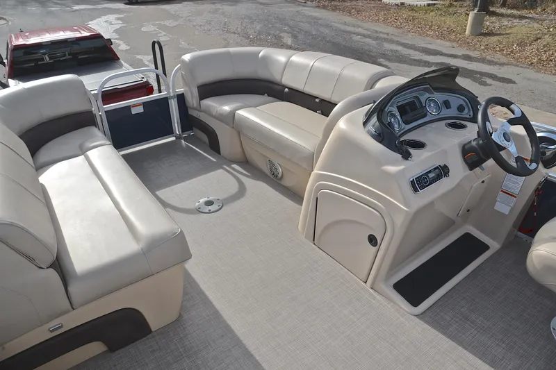 Slide: The Image of 2019 Sun Tracker Party Barge 22 XP3 interior with spacious seating and modern helm. - 22