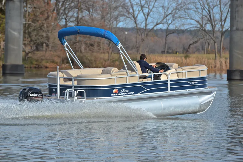 Slide: The Image of 2019 Sun Tracker Party Barge 22 XP3 cruising on a calm lake. - 5