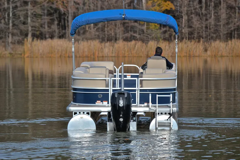 Slide: The Image of 2019 Sun Tracker Party Barge 22 XP3 pontoon boat on a calm lake. - 7
