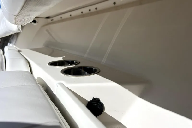 Slide: The Image of 2018 Regulator 34 Center Console interior with cup holders and seating. - 13