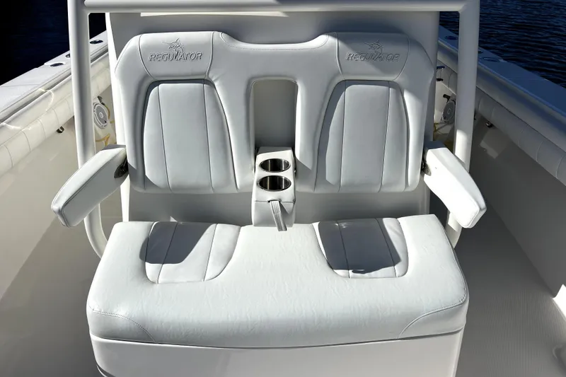 Slide: The Image of 2018 Regulator 34 Center Console boat seating with cup holders and armrests. - 18