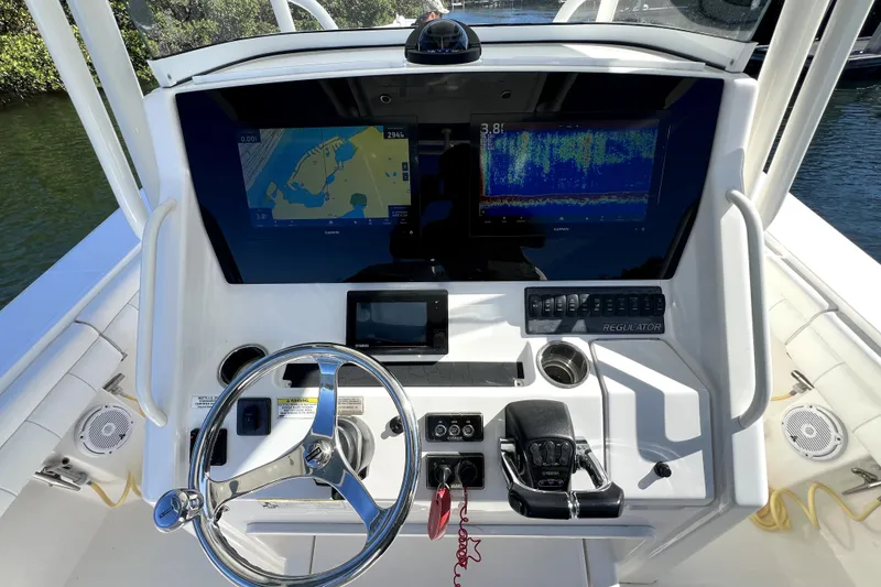 Slide: The Image of 2018 Regulator 34 Center Console dashboard with navigation and control systems. - 26