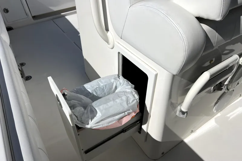 Slide: The Image of 2018 Regulator 34 Center Console boat with built-in trash compartment. - 32