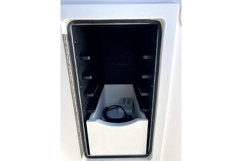 Slide: The Image of Storage compartment in a 2018 Regulator 34 Center Console boat. - 33