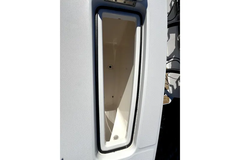 Slide: The Image of 2018 Regulator 34 Center Console storage compartment, open and empty. - 39