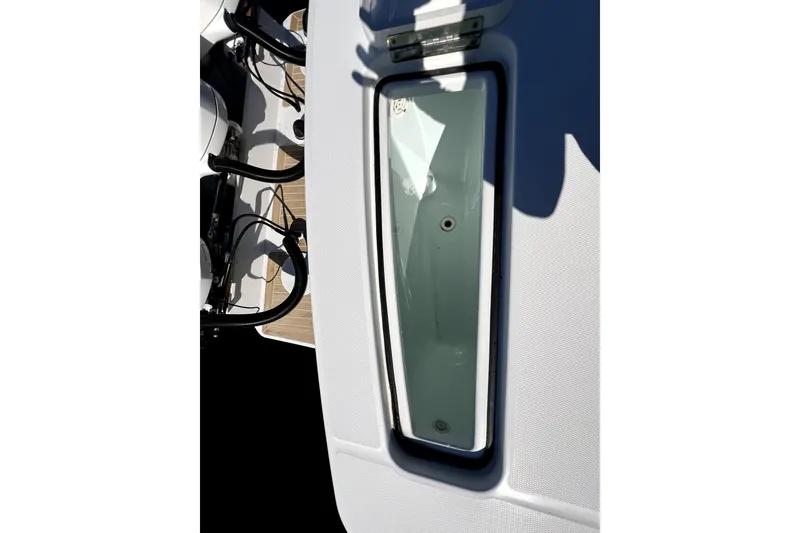 Slide: The Image of 2018 Regulator 34 Center Console boat deck with storage compartment open. - 40