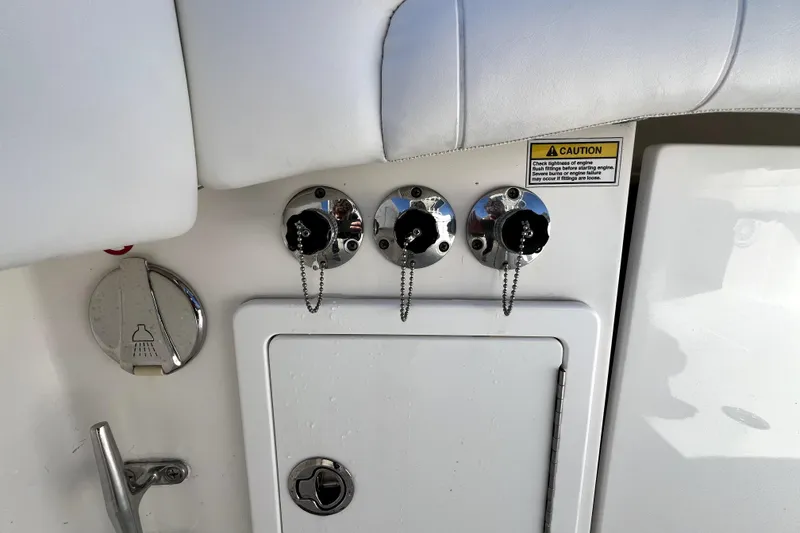 Slide: The Image of 2018 Regulator 34 Center Console boat controls and caution label detail. - 41