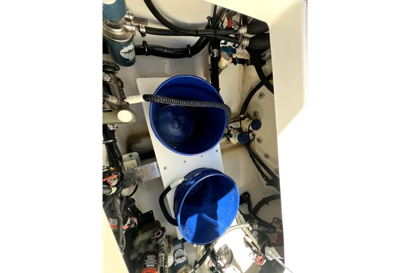 Slide: The Image of Engine compartment of 2018 Regulator 34 Center Console with blue buckets and wiring. - 43