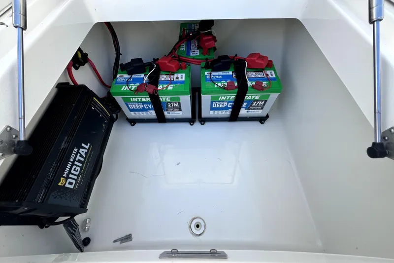 Slide: The Image of Battery compartment of 2018 Regulator 34 Center Console with Interstate deep cycle batteries. - 58