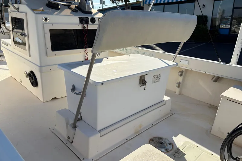 Slide: The Image of 1992 Parker 18 boat interior with storage bench and control panel. - 10