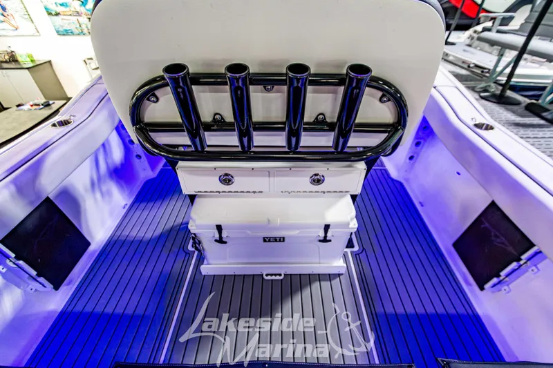 Slide: The Image of 2026 Tidewater 232 LXF boat interior with seating and Mercury engine at Lakeside Marina. - 13