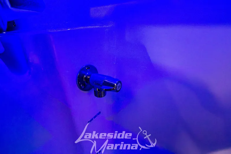 Slide: The Image of 2026 Tidewater 232 LXF boat rod holders in a marina setting. - 17