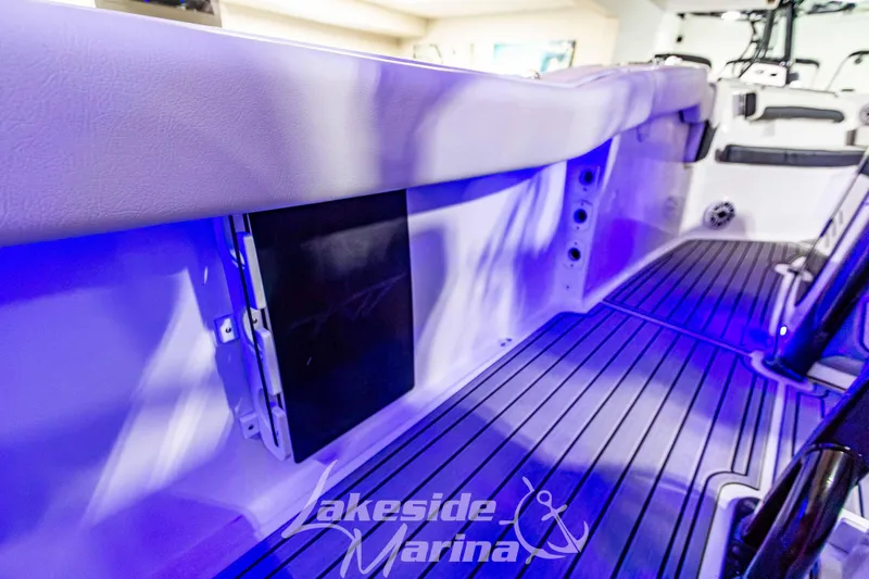 Slide: The Image of 2026 Tidewater 232 LXF boat interior with blue lighting and Lakeside Marina logo. - 18