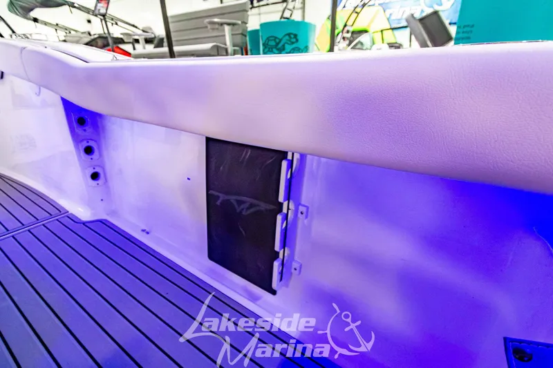 Slide: The Image of 2026 Tidewater 232 LXF boat interior with blue lighting at Lakeside Marina. - 19