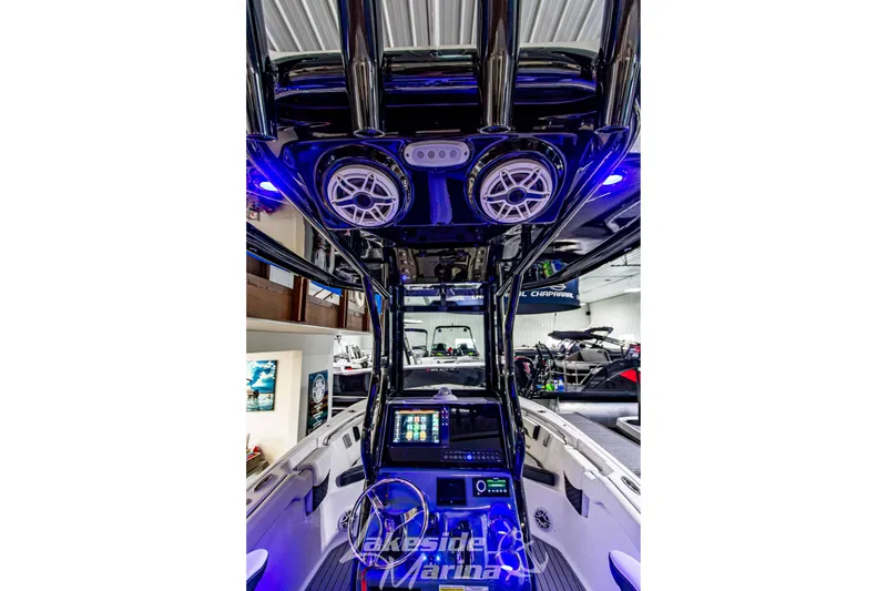 Slide: The Image of 2026 Tidewater 232 LXF boat interior with modern controls and blue lighting. - 22