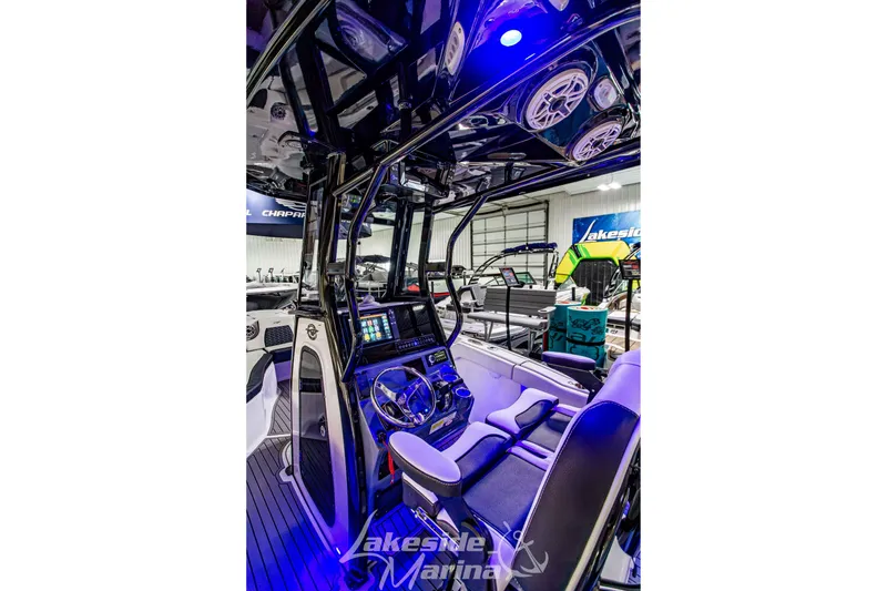 Slide: The Image of Interior view of 2026 Tidewater 232 LXF boat with advanced dashboard and speakers. - 23