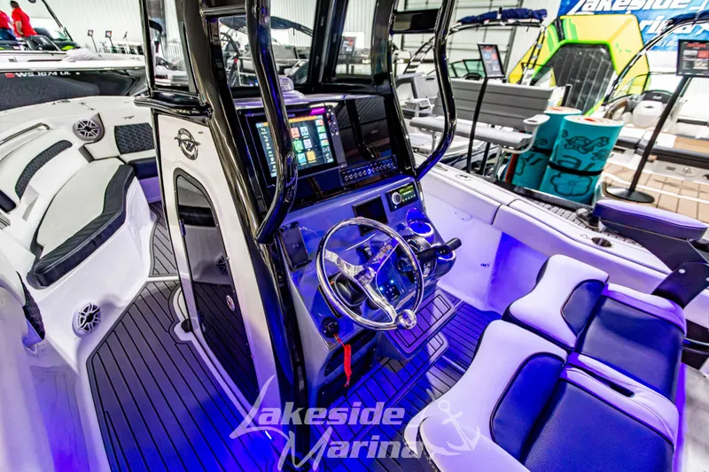 Slide: The Image of 2026 Tidewater 232 LXF boat interior with modern dashboard and seating. - 24