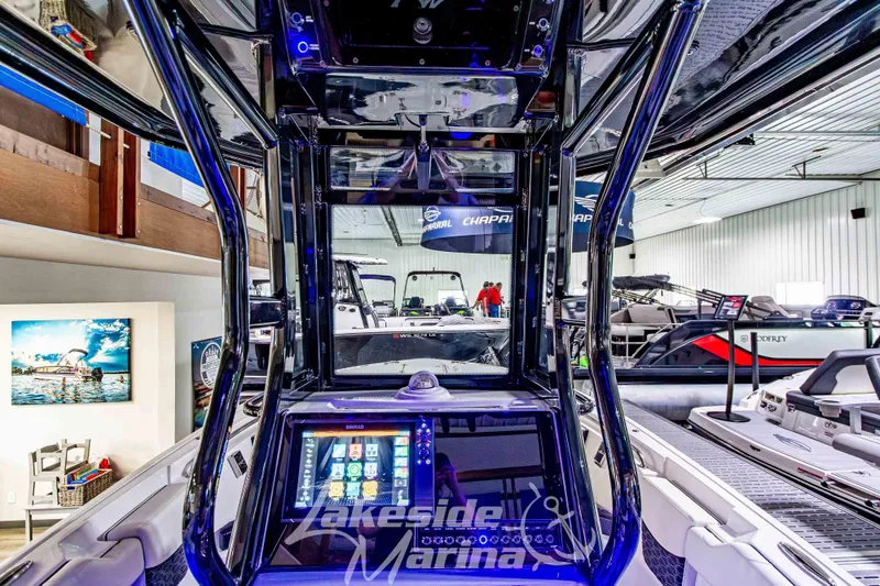 Slide: The Image of 2026 Tidewater 232 LXF boat dashboard with illuminated controls and modern navigation system. - 27