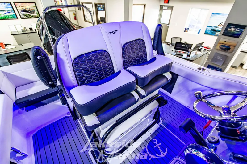 Slide: The Image of 2026 Tidewater 232 LXF boat interior with luxurious seating and modern design. - 30