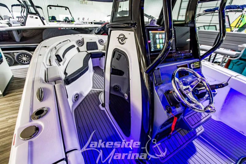 Slide: The Image of 2026 Tidewater 232 LXF boat interior with modern dashboard and seating. - 32