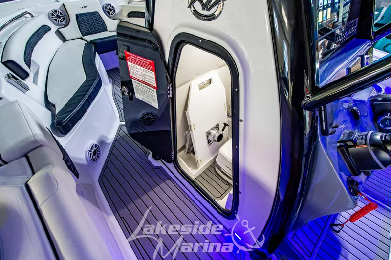 Slide: The Image of 2026 Tidewater 232 LXF boat interior with modern helm and seating at Lakeside Marina. - 33