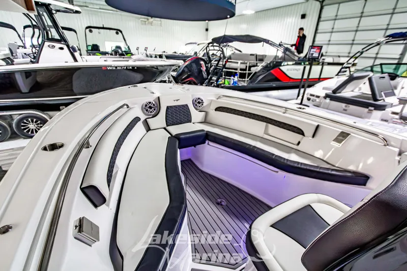 Slide: The Image of 2026 Tidewater 232 LXF boat interior with compact marine toilet and storage. - 35