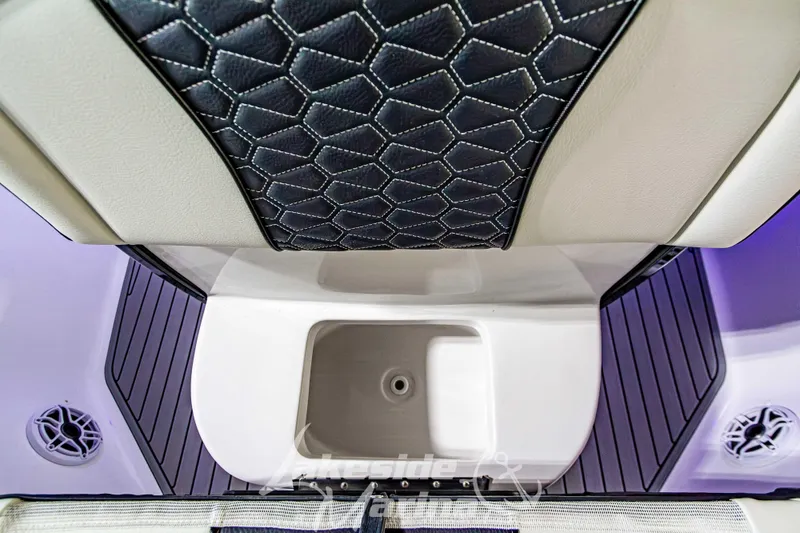 Slide: The Image of 2026 Tidewater 232 LXF boat interior with modern seating and ambient lighting. - 39