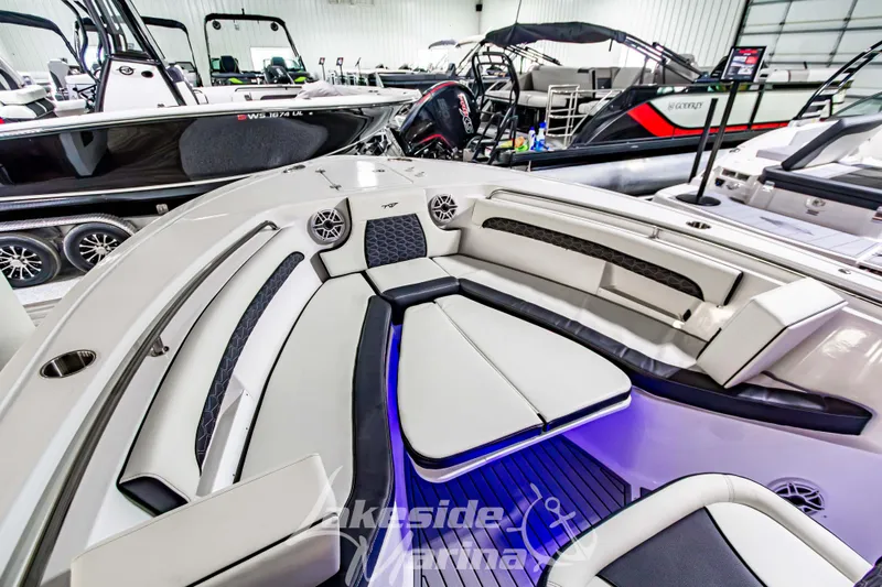 Slide: The Image of 2026 Tidewater 232 LXF boat interior with stylish seating and integrated sink. - 40