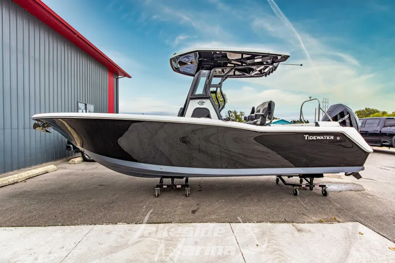 Slide: The Image of 2026 Tidewater 232 LXF boat interior with anchor compartment, showcased at a marina. - 51