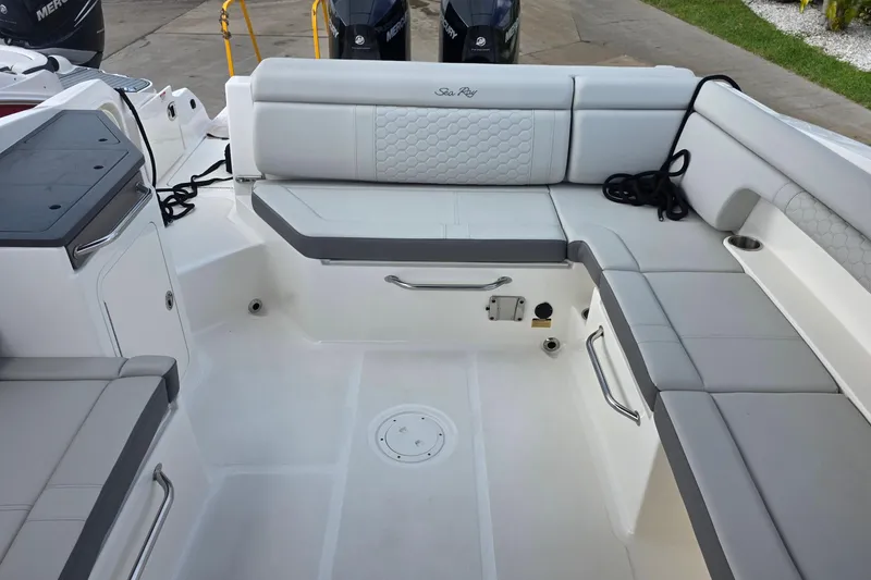 Slide: The Image of 2021 Sea Ray SDX 290 Outboard boat interior with spacious seating and modern design. - 15