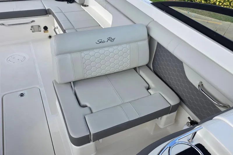 Slide: The Image of 2021 Sea Ray SDX 290 Outboard interior seating with elegant gray upholstery and hexagonal pattern. - 18
