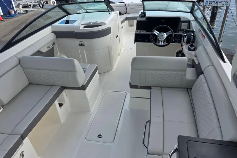 Slide: The Image of 2021 Sea Ray SDX 290 Outboard boat interior with luxurious seating and modern dashboard. - 29