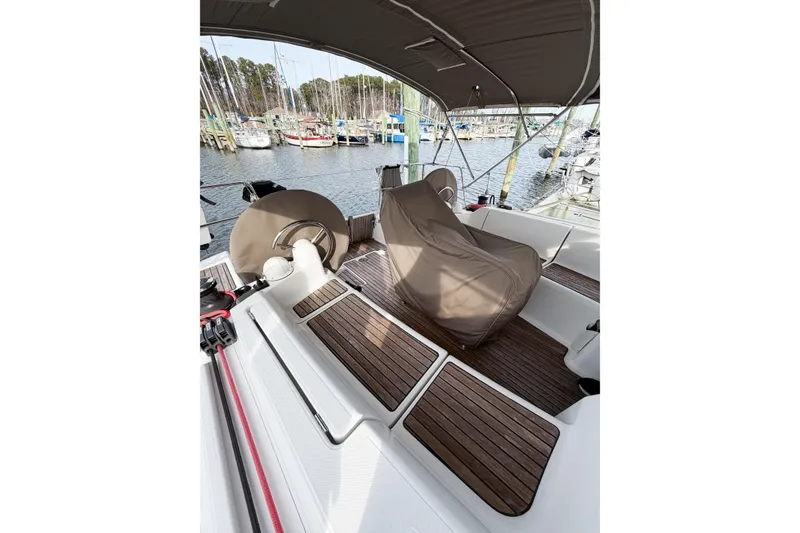 Slide: The Image of Cockpit of 2013 Jeanneau Sun Odyssey 409 sailboat with covered steering wheel. - 14
