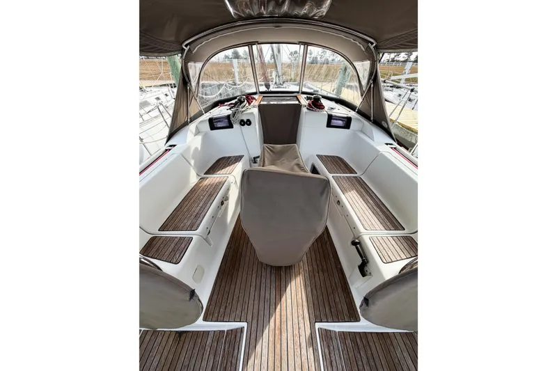 Slide: The Image of Interior view of 2013 Jeanneau Sun Odyssey 409 sailboat cockpit with wooden flooring. - 16