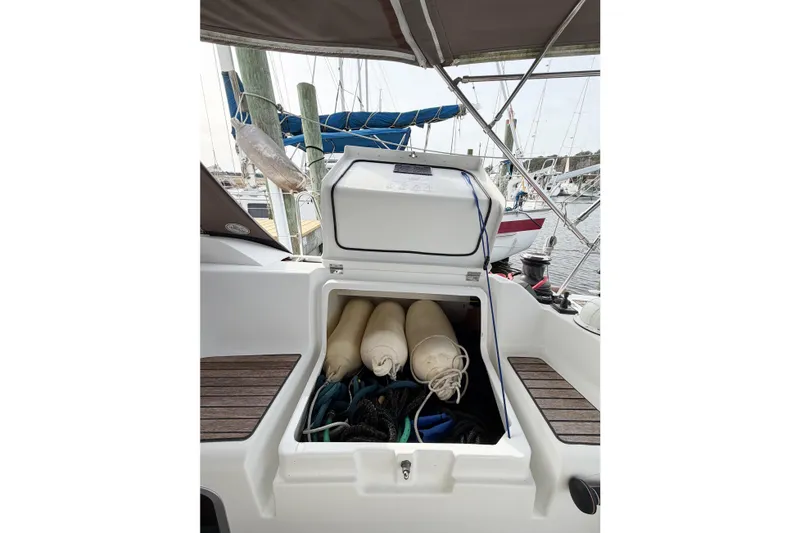 Slide: The Image of Storage compartment on 2013 Jeanneau Sun Odyssey 409 sailboat, containing fenders and ropes. - 19